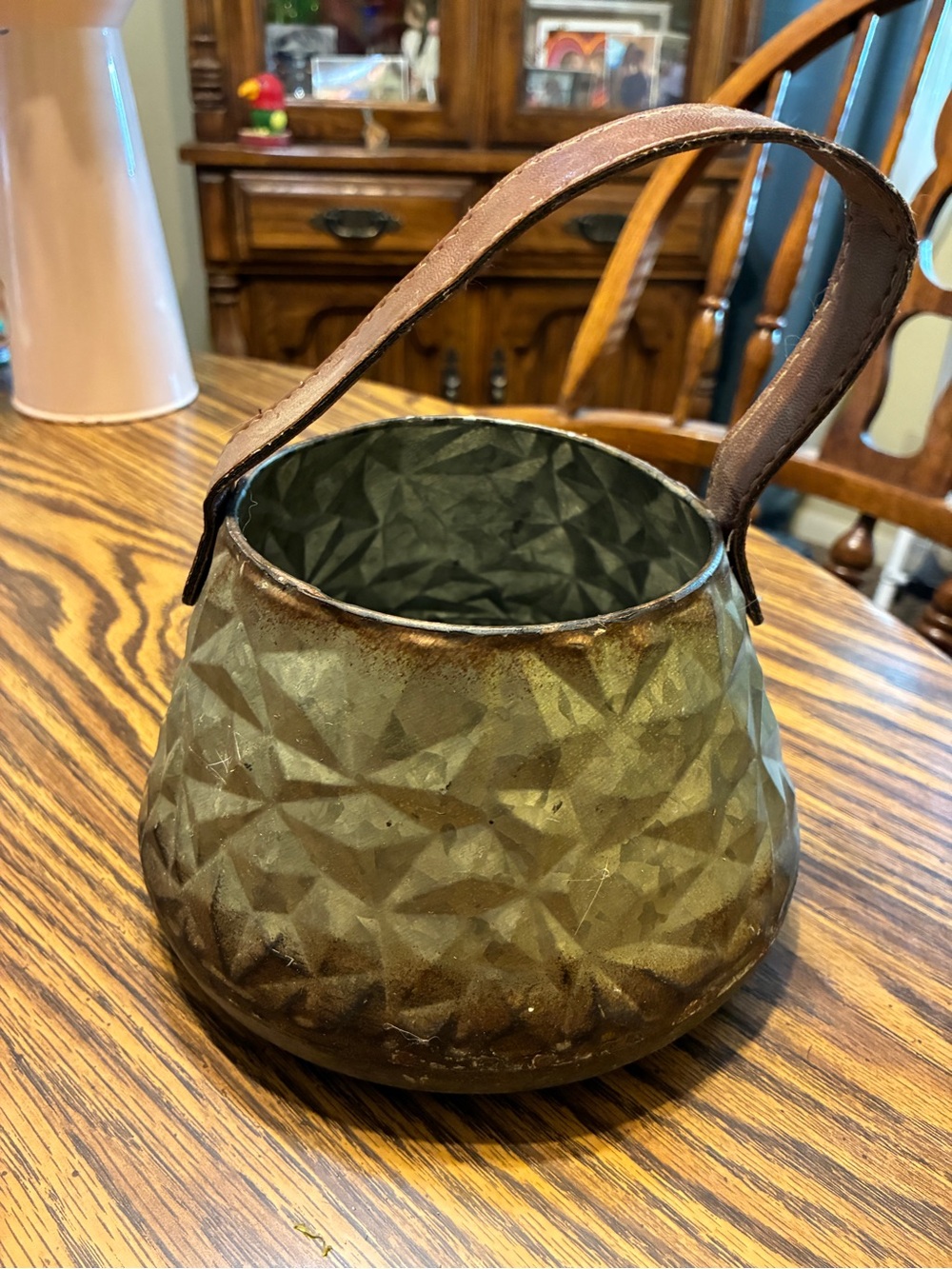decorative metal bucket or planter with a geometric faceted body & strap handle